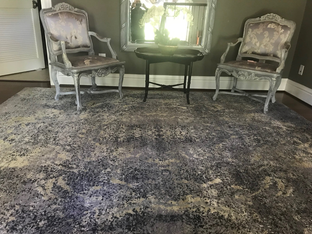 Sitting area with vintage abstract charcoal and cream rug