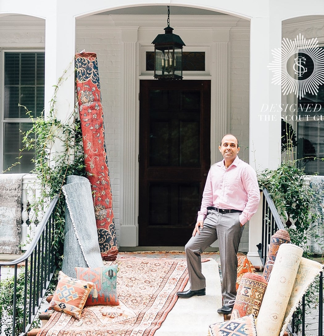 Wahi Rugs showroom porch with rolled rugs