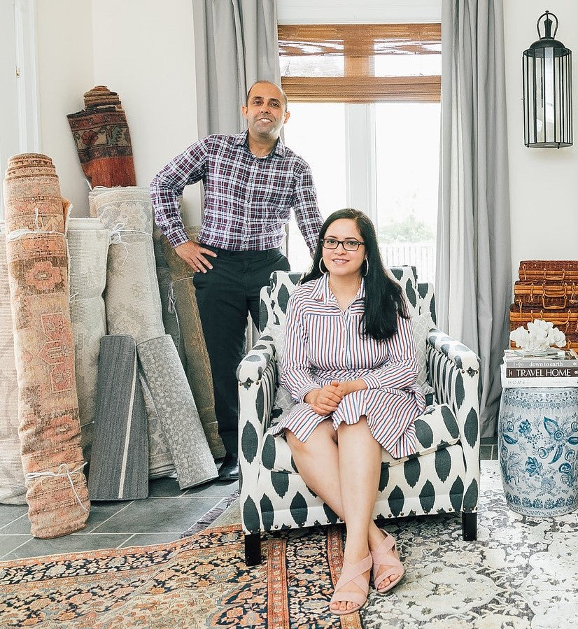 The Wahi family today, at home with their rugs